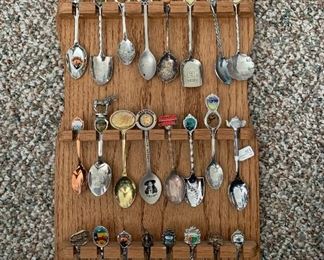 Lots of collector spoons and handmade racks to display them!