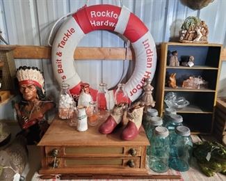 Milk bottles from all over, spool cabinet. 
