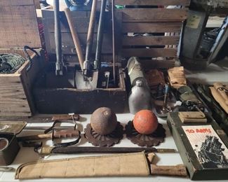 Military shovels, cannon balls 