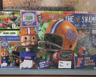 PUZZLE THATS PUT TOGETHER, (THE SARAN WRAP DISTORTS THE BEAUTY OF THESE PUZZLES)