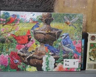 PUZZLE THATS PUT TOGETHER, (THE SARAN WRAP DISTORTS THE BEAUTY OF THESE PUZZLES)