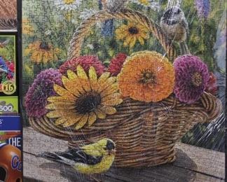 PUZZLE THATS PUT TOGETHER, (THE SARAN WRAP DISTORTS THE BEAUTY OF THESE PUZZLES)