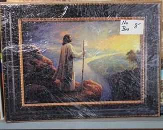 PUZZLE THATS PUT TOGETHER, (THE SARAN WRAP DISTORTS THE BEAUTY OF THESE PUZZLES)
