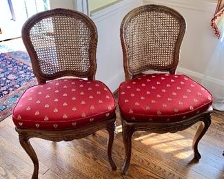 $350 - Pair of vintage cane chairs with "bee" cushions; Made in Spain; 35"H x 20"W x 21"D. Height to seat 20"