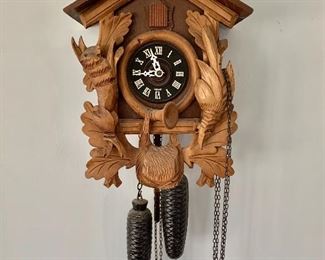 $250 - German cuckoo clock; 21"H x 10"W x 6"D.  Tested and working  