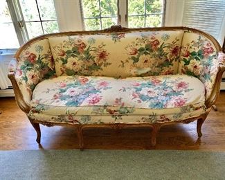 $350 - AS IS French style vintage love seat with down cushion; 36 1/2"H x 70"W x 24"D. Height to seat 19". Tear in backrest  