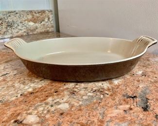$40 - Le Creuset oval baking dish; 1 1/2"H x 11"L including handles x 7"W