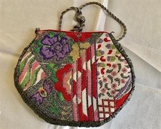 $20 - Vintage multicolored purse; 23"L x 8 1/2'W 