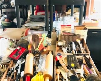 many kitchen gadgets, glassware and bakeware