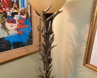 Decorative antler floor lamp. Painting not for sale