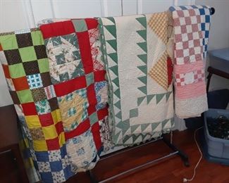 Quilts all over with sewing/books/crafty stuffs...