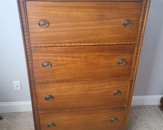 Mid century style four drawer chest features large spacious drawers. Chest is in ok condition with signs of wear. Chest includes small cedar pieces and metal wheels in the drawer though they seem to not go to the piece itself. Measures 33" x 18" x 58". https://ctbids.com/#!/individualEstateSales/316/9887