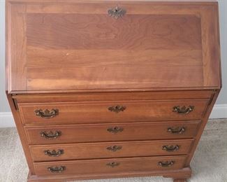 Secretary desk is in good condition and has skeleton key to lock top section. Drawers have a beautiful dovetail craftsmanship. Inside there are three small drawers and cubbies to separate important papers. There are four larger drawers under the desk part. Full piece measures 34" x 18" (closed) 32" (open) x 39". https://ctbids.com/#!/individualEstateSales/316/9887