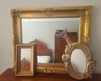 Beautiful gold toned framed mirror. Ornate carvings at every center and corner, Measures 26" x 2" x 22". Flower frame is made of plaster and was made in 1967 by Miller studios and measures 10" x 2" x 11". https://ctbids.com/#!/individualEstateSales/316/9887