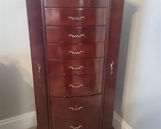 Beautiful large jewelry armoire has eight drawers, the sides open up and so does the top. The mirror also pulls out to sit at an angle so you can see perfectly how the jewelry looks on you. Measures 18" x 15" x 41". https://ctbids.com/#!/individualEstateSales/316/9887