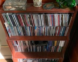 bookcase with several cd's