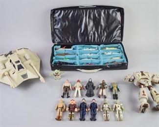 15	Grouping of Star Wars Figures and Case	A grouping of Star Wars action figures, 24 in total. Figures of interest include C3PO, Darth Vader, the Emperor, and a Chewbacca Transformer. A Tara Toy Star World figure carrying case, and a Kenner Rebel Armored Snowspeeder. All are in good condition

