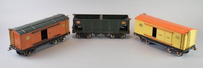 22	Group of Lionel Lines Trains	A group of Lionel Lines train cars. These include 2 yellow and orange No. 214 Automobile Furniture, and 1 green 110,000 lbs. capacity car. 1 train car still has its tag. Good condition with some scratches.
