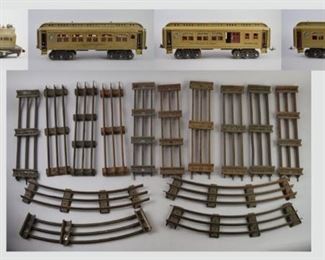 29	Grouping of Lionel Train Cars and Tracks	A grouping of Lionel Lines train cars and 8 tracks. These include: A locomotive 402E (missing wheel) Lionel baggage parlor car No. 419 Lionel observation car No. 490 Lionel parlor car No. 418 Lionel dining car No. 431 4 straight tracks 4 carved tracks All are in good condition.
