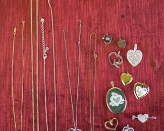 101	Costume Jewelry Heart Pendants	Lot includes gold tone and silver tone rhinestone heart pendants; faux pearl pendant; gold tone heart locket; rhinestone heart pin
