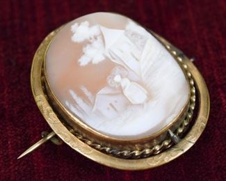 115	Victorian Cameo Mourning Brooch	Scenic vintage cameo brooch with locket (contains hair) - no marking on back. 1 1/4"L
