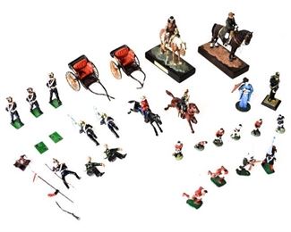 120	Group of Lead & Other Figures	Lead figures including 2 officers in carriages, 2 soldiers on horseback (1 with arm detached), 6 soldiers, 6 soccer players, 6 additional figures; and 2 figurines on horseback Indio Pampa S.XIX and Gral. Julio A. Roca. Larger figurines on horseback 4 3/4"H
