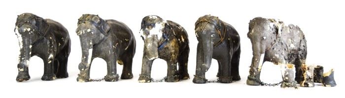 125	5 Papier Mache Circus Elephants	1 with porcelain figure (arms and legs detached). Elephants all with losses and wear. Each approximately 9"L x 6 3/4"H
