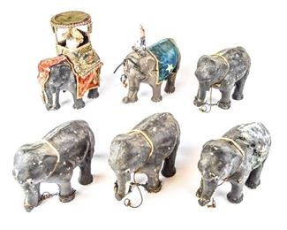 126	6 Papier Mache Circus Elephants	1 with composition rider. All with losses and wear, 1 with leg detached. Each approximately 9"L x 6 3/4"H
