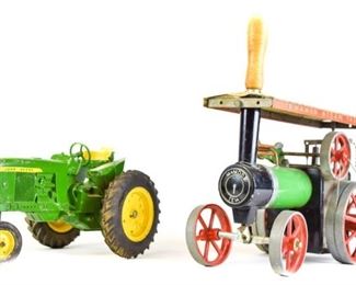 130	2 Toy Tractors	Cast iron John Deere tractor, 9"L x 5"H; Mamod Steam Tractor TE1A, with wooden steering handle, 10"L x 11"H including handle. Minor paint loss to both.
