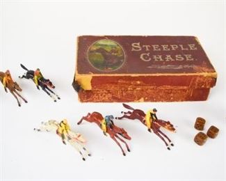 141	JWS & S Bavaria Steeple Chase Game	JWS & S Bavaria Steeple Chase game, in original box. Including leather container and 3 dice, 6 lead horses with jockeys. Missing game board, significant wear to box.
