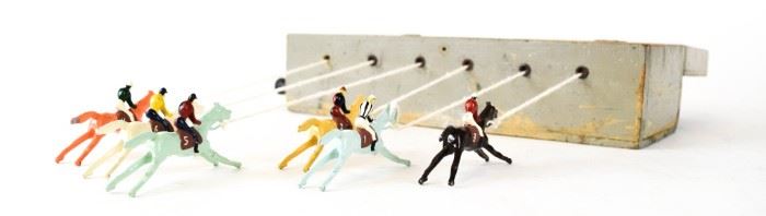 147	Ascot Type Lead Horse Racing Game	Horse racing game with 6 lead horses in a wooden box with hand winder. Some paint loss to box. Each horse 2 3/4"L, box 11 1/4"L (including winder) x 3 1/4"H x 3 3/4"D
