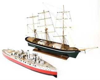 156	2 Wooden Boat Models	Clipper ship, on wooden base, 24"L x 16"H (minor damage where boat attaches to base); Rivadavia battleship (top damaged and pieces detached), 19 1/2"L
