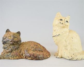 165	Iron Art & Hubley Cast Iron Cat Doorstops	2 cast iron cat doorstops. Cat lying down, stamped Iron Art, 10 1/2"L x 6 1/4"H; seated fireside cat, stamped Hubley, 8 1/4"H. Minor paint loss to Hubley, paint loss to Iron Art.
