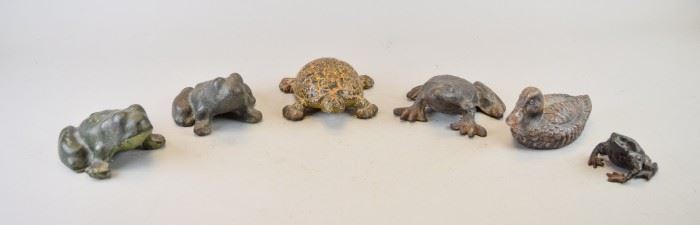 167	Grouping of Cast Iron Animal Doorstops	Lot includes five frogs (two in the style of Hubley), largest 5 1/2"; one turtle 8"L; one duck 6 1/2"L, weighs 6lbs. Minor wear
