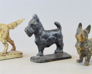 170	Grouping of Cast Iron Dogs	Lot includes cast iron retriever/pointer doorstop, 8"L; brass Scottie dog doorstop, 6"L; cast iron Scottie doorstop, 4 1/2"L; small Scottie paperweight, 3"L. Minor wear and paint loss throughout
