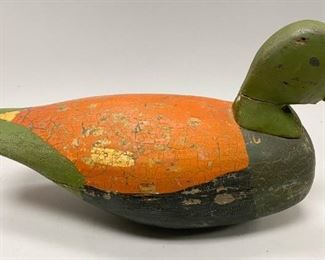 183	Early 20th Century Duck Decoy	An early 20th century hand painted duck decoy, with lead weight on the bottom. Painted green, black, and orange. Heavy crazing throughout, and split along duck's neck and around the body-please see pictures. 13.5" L x 6" W x 9" H
