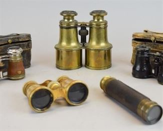 193	Grouping of Vintage Opera Glasses and Telescope	Mother of pearl and gold toned opera glasses, working lens; marked Lemaire Paris, F I, made in France, measures 3"H x 4"W; Brass and leather vintage opera glasses with original leather case, marked "Chevalier Paris." Leather is worn on right lens; 1.75" H x 4.25" W x3.25" D; Lemaire Fabi Paris black leather opera glasses; original leather case is cracked; 2 1/2" x 4" Gold tone opera glasses/binoculars measure 5" x5"; leather and brass telescope; measures 6" closed and 16" extended.
