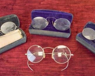 195	Group of Vintage Eyeglasses	American Optical Cortland gold filled eyeglasses, circa 1930's. Very good condition, some oxidization present. Pince-nez with black leather case with purple velvet interior. Good condition, some oxidization and rust consistent with its age. Pince-nez with black thread loop and black leather carrying case, made by the California Optical Co. "PAT NOV 95" is stamped on the left nose clip. Good condition. Gold-plated pince-nez from B.A. Weber Jeweler and Optometrist, Ridgewood, NJ. Pince-nez are marked JKOC, and have its original carrying case. Very good condition.
