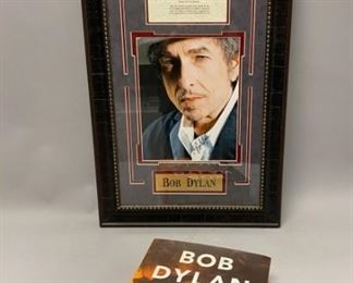 204	Bob Dylan Book & Autographed Photo Print	Autographed Bob Dylan photo print, framed with a typed lyric sheet for Mr. Tambourine Man, 27" x 15" including frame; together with Bob Dylan All the Songs: The Story Behind Every Track, by Philippe Margotin & Jean-Michel Guesdon, c. 2015, Black Dog & Leventhal Publishers. Minor wear to dust jacket.
