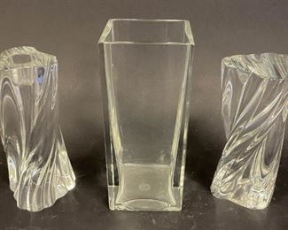 213	3 Piece Baccarat Crystal Grouping	Square vase, 3"W x 3"D x 7"H; pair of twist candlesticks, each 6"H. All signed with etched Baccarat France marks on undersides. Chips to bottom rim of vase.
