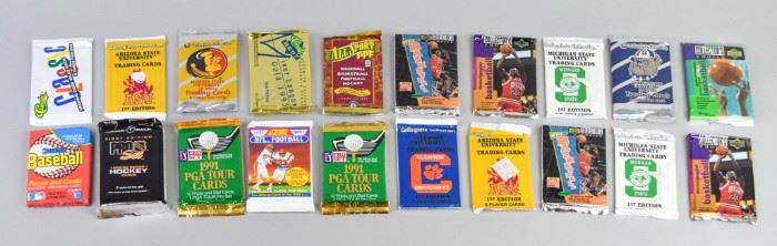301	Group of Sports Trading Cards Packs	A group of 89 training card sets from the 1980's and 1990's from basketball, football, baseball and other sports. All are sealed and are in very good condition.
