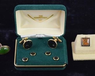 354	Grouping of Cufflinks including Burberry	A grouping of men's cufflinks, including: A Burberry "The Competition" cufflink set. An 18 karat rose gold cufflink set with jade oval insets, weighing 10 grams. Very good condition.
