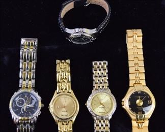 355	Grouping of Watches	A grouping of 5 watches, including: A Neiman Marcus Japan Movement watch with diamond chip bezel. A Neiman Marcus watch with diamond chips on face. Calvin Hill Swiss movement watch A coated azure watch A fossil watch. All in very good condition.
