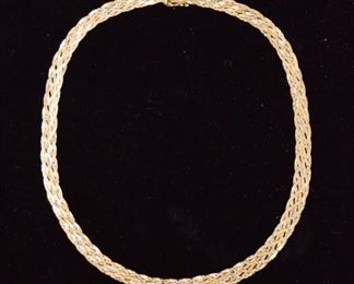 359	Braided Gold Chain	A 18" long braided gold chain, 14 karat. Necklace is in fine condition. Weighs in at 14.7 grams.
