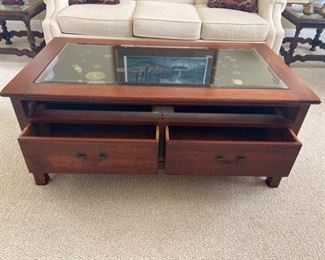PRICE: $300                                                                                                Coffee/display table with double-sided drawers (they pull out from both sides)and lock & key. Items inside not for sale. 44 x 24 x 18.5 