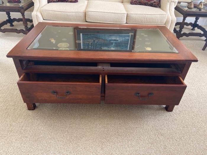 PRICE: $300                                                                                                Coffee/display table with double-sided drawers (they pull out from both sides)and lock & key. Items inside not for sale. 44 x 24 x 18.5 