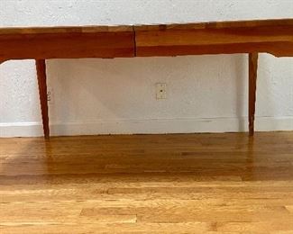 Cherry dining table with drawers on each end