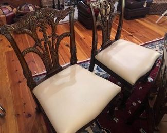 2 Theodore Alexander chairs covered with white fabric