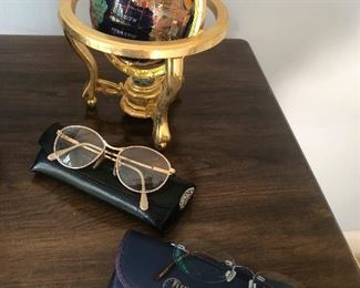small globe, large glasses