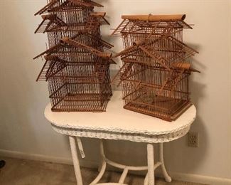 2 vintage bird cages(decorative and fragile) antique wicker table